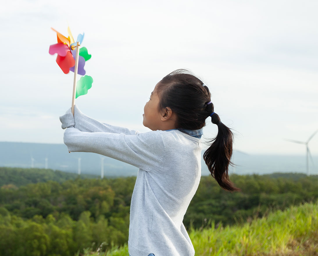 girl holding a windmill