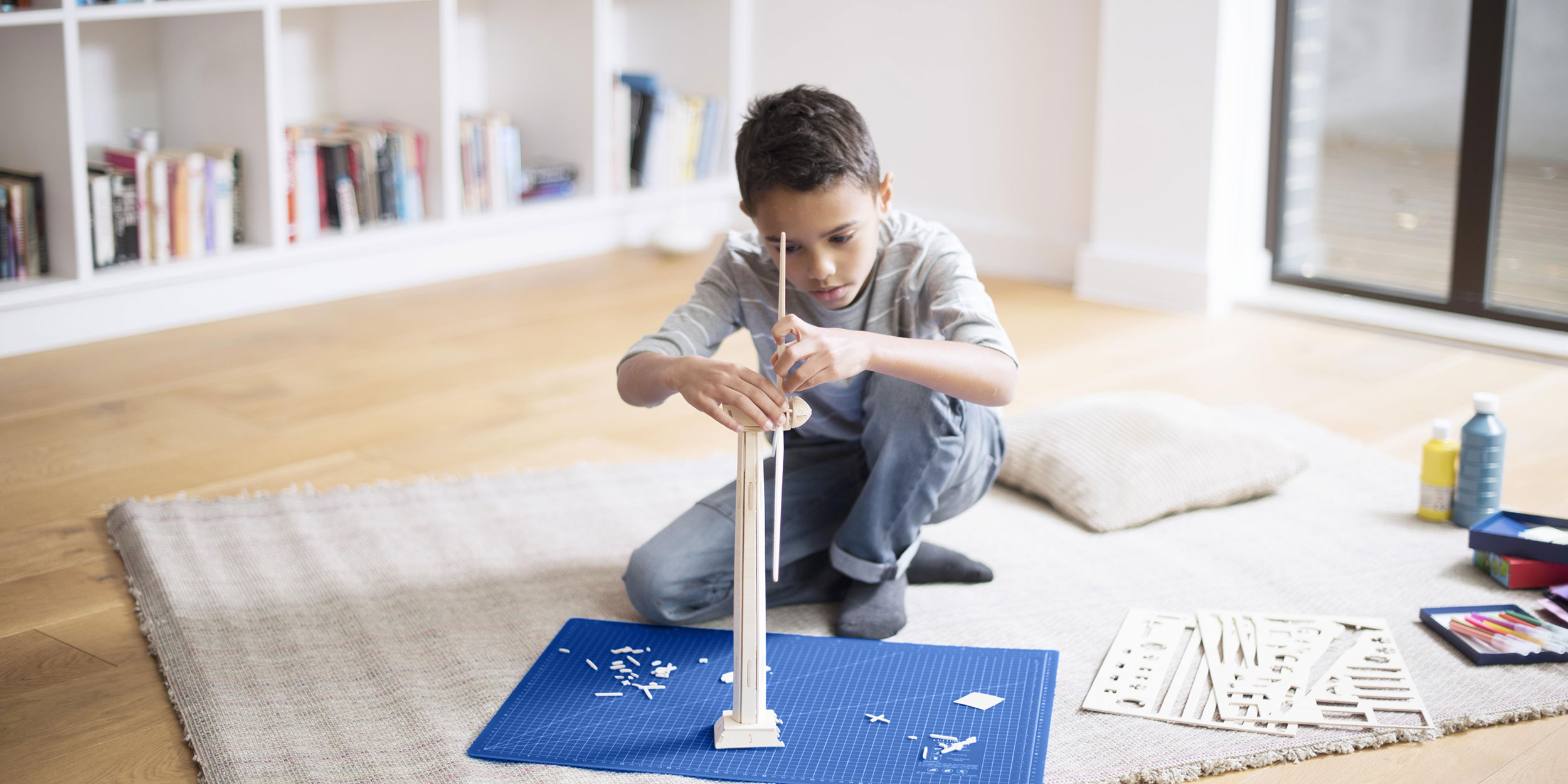 boy building windmill model