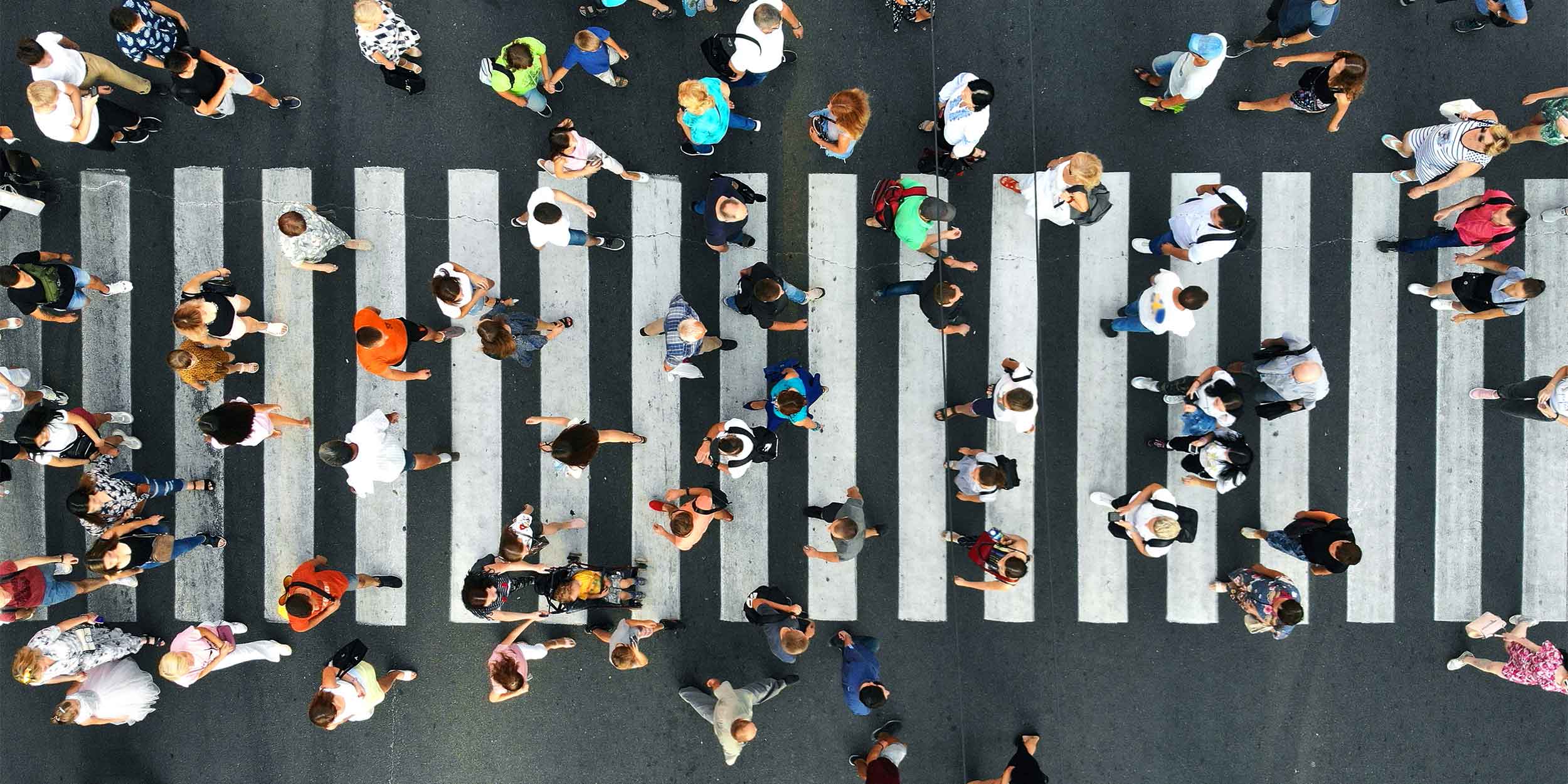 large group of people crossing the street