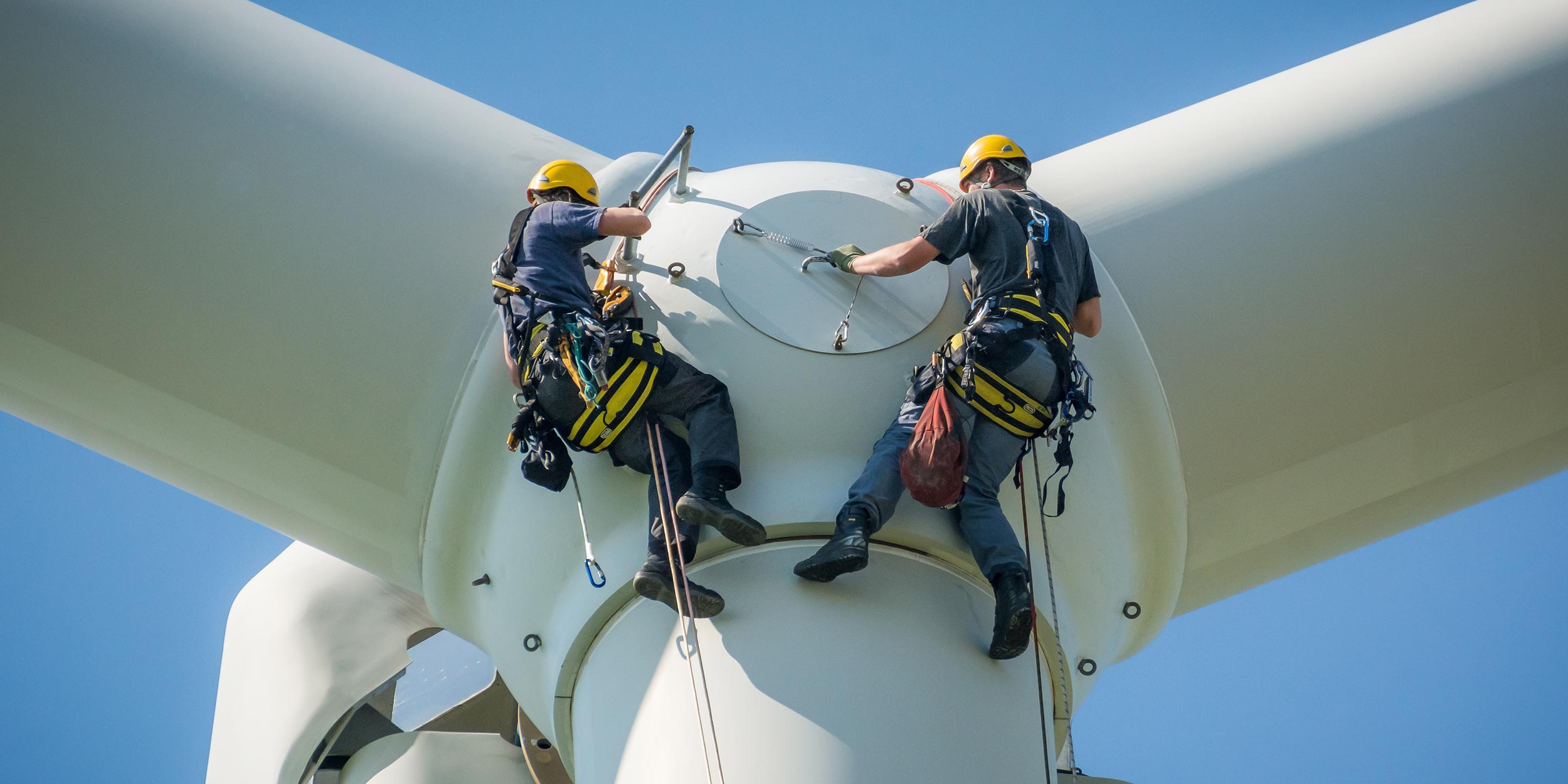workers on a wind turbine