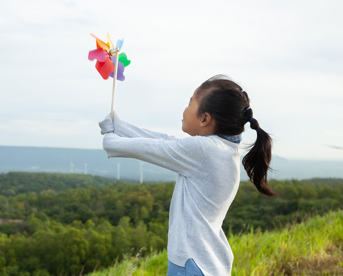 girl holding a windmill